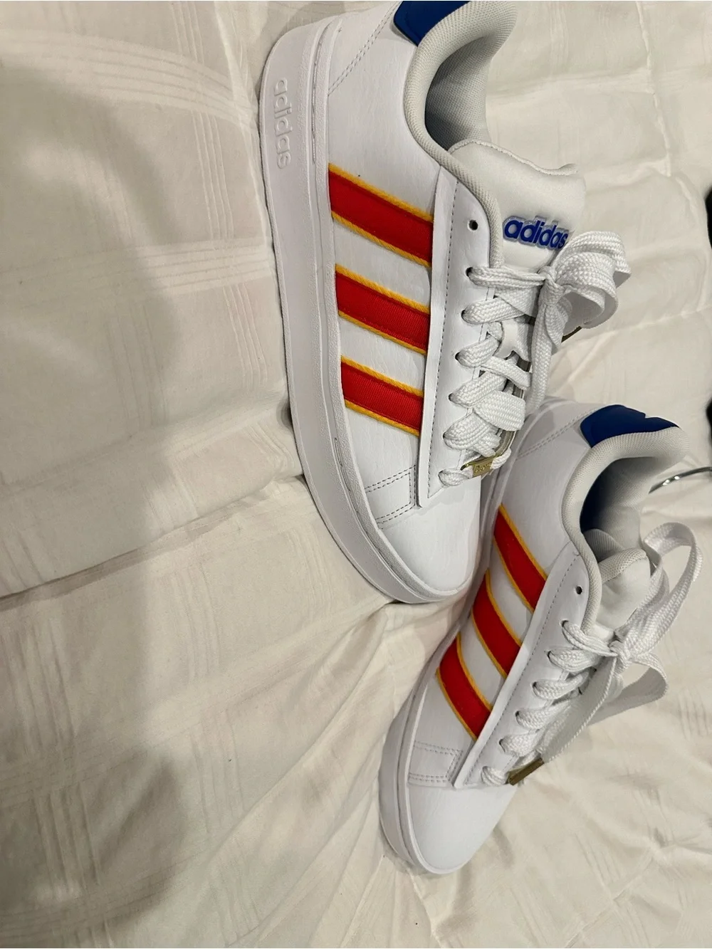 adidas Women’s White Sneakers with Red and Yellow Stripes and Blue Accents
